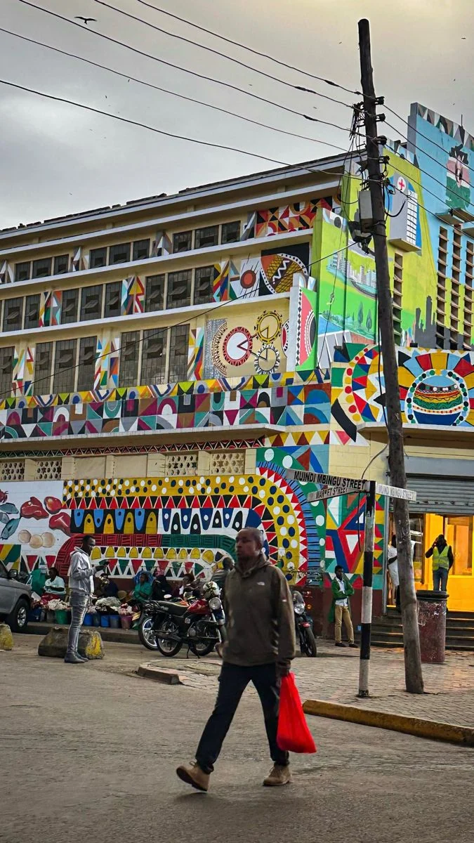 A colorful painted commercial building on a Nairobi street