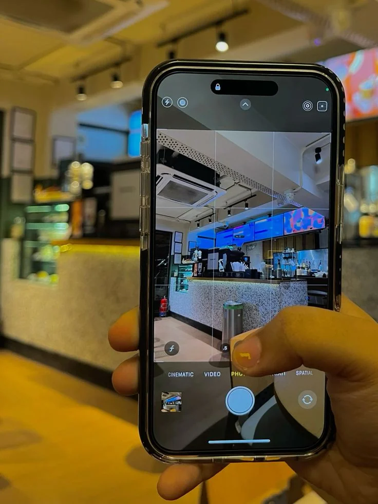 A smartphone camera framing the interior of a retail location